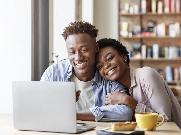 Couple analyzing online results for the best and worst homeowners insurance quote.