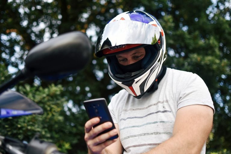 Biker looking at motorcycle insurance quotes from Global Guard.